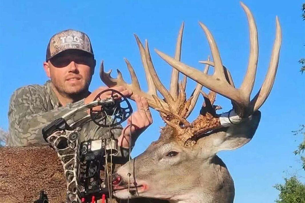 Bowhunter with massive buck
