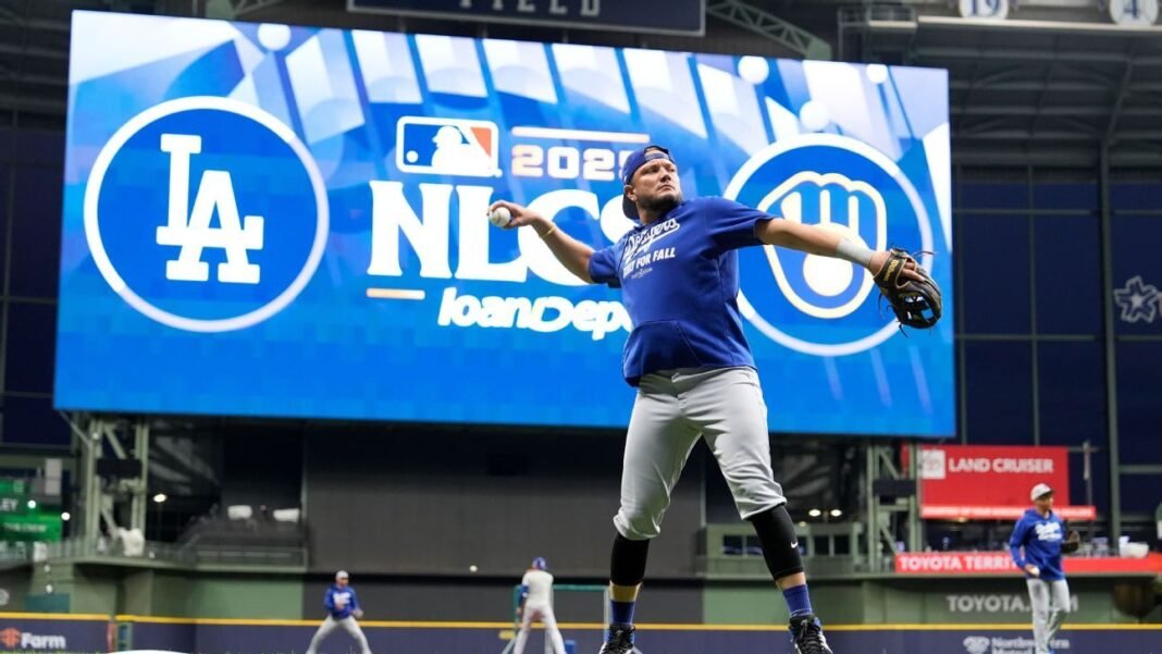 Dodgers keep Miguel Rojas on NLCS roster; Brewers hold steady